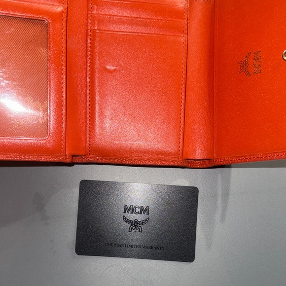 MCM Orange Leather Trifold Wallet with Gold Logo Accents - Picture 3 of 7
